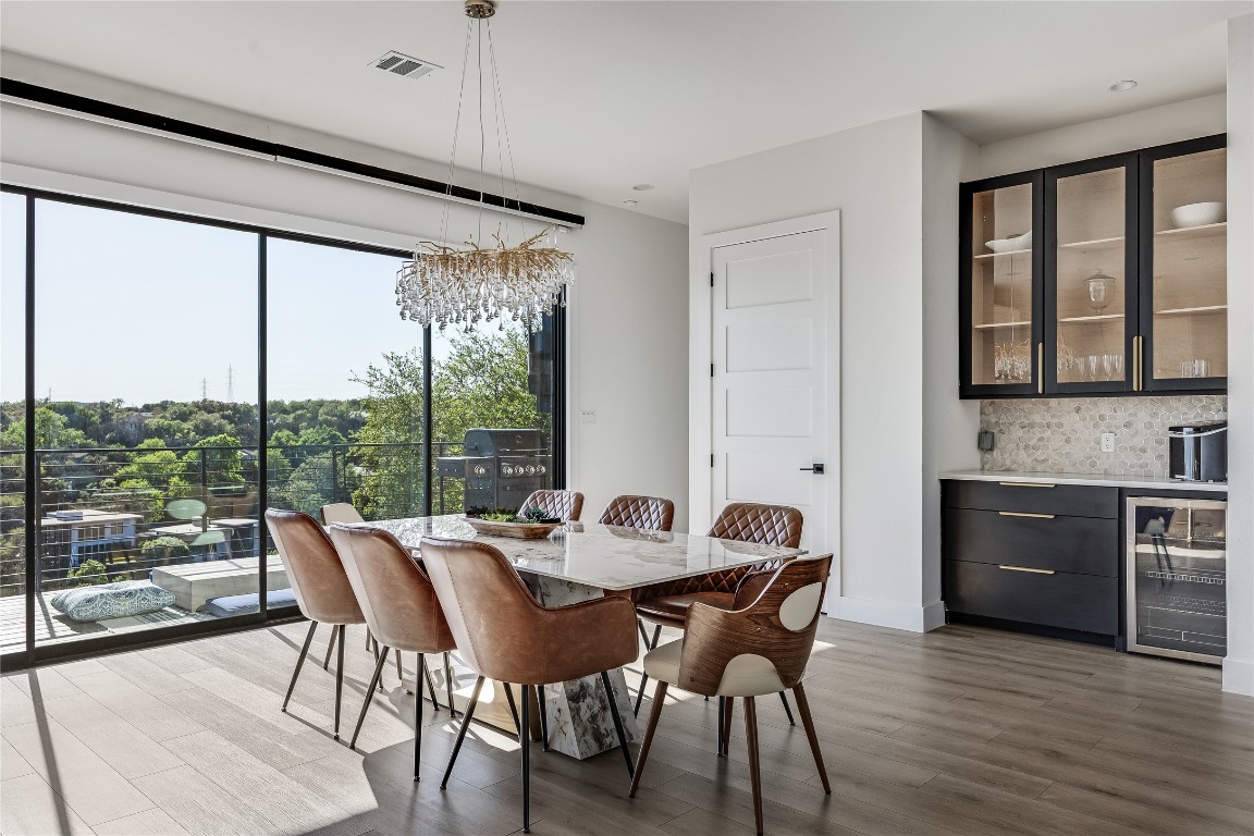 3138 Chisholm Trail Austin, TX 78734 - Photo 12 of 40 a dining room with furniture window and wooden floor