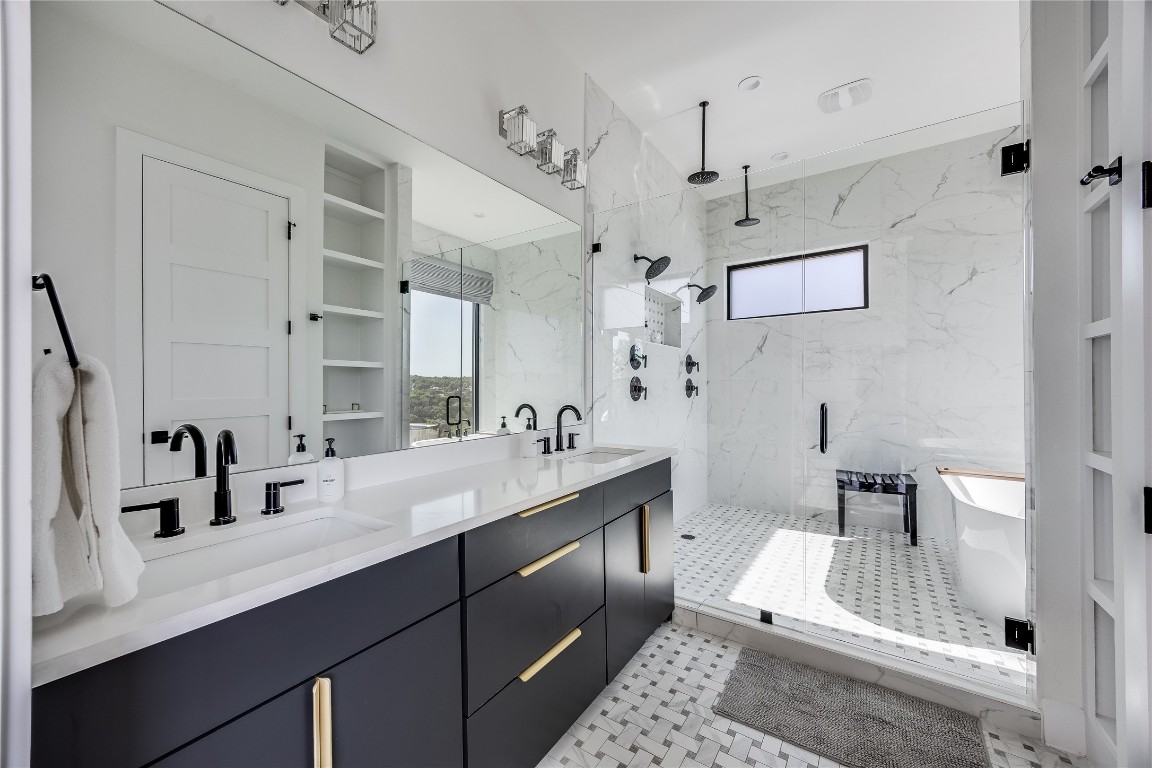 3138 Chisholm Trail Austin, TX 78734 - Photo 17 of 40 a bathroom with a double vanity sink mirror and