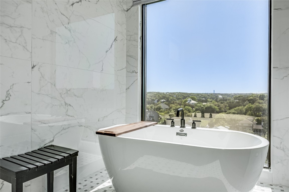 3138 Chisholm Trail Austin, TX 78734 - Photo 18 of 40 a bathroom with a sink and a bathtub