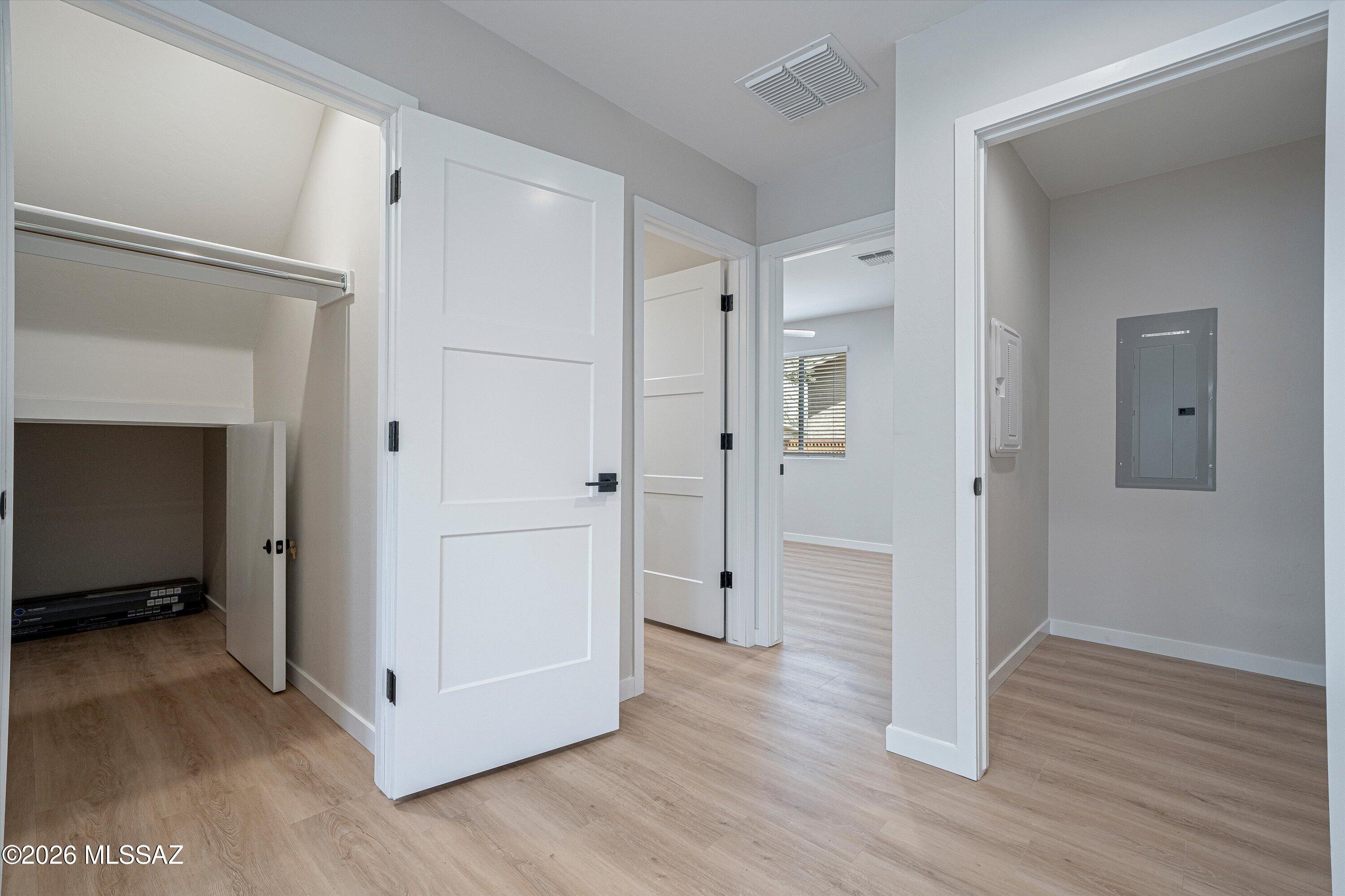 739 North Queen Avenue, Unit 2 Tucson, AZ 85705 - Photo 24 of 28 a view of a hallway with wooden floor