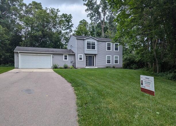10546 Culver Road Brighton, MI 48114 - Photo 1 of 22 Front with sign