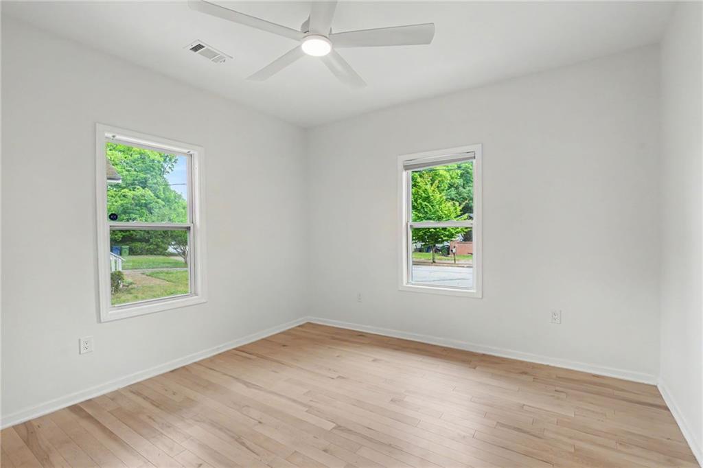 827 Elbert Street Southwest Atlanta, GA 30310 - Photo 11 of 33 an empty room with a window and a ceiling fan