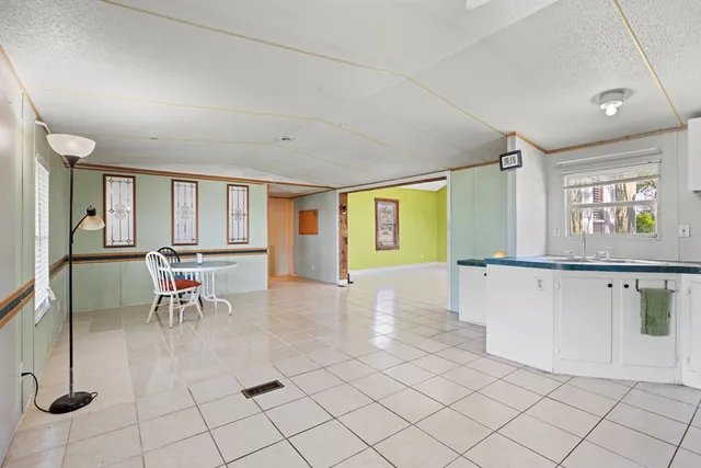 a view of a livingroom with furniture and a window