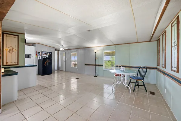 a lobby with furniture and a rug