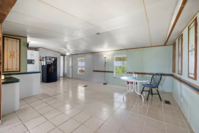 a lobby with furniture and a rug