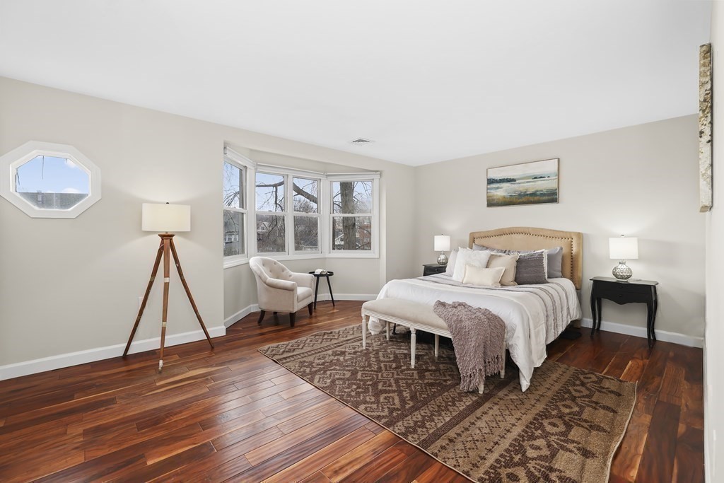 4 Rowe Court, Unit 4 Boston, MA 02131 - Photo 18 of 41 a bedroom with a bed and a window