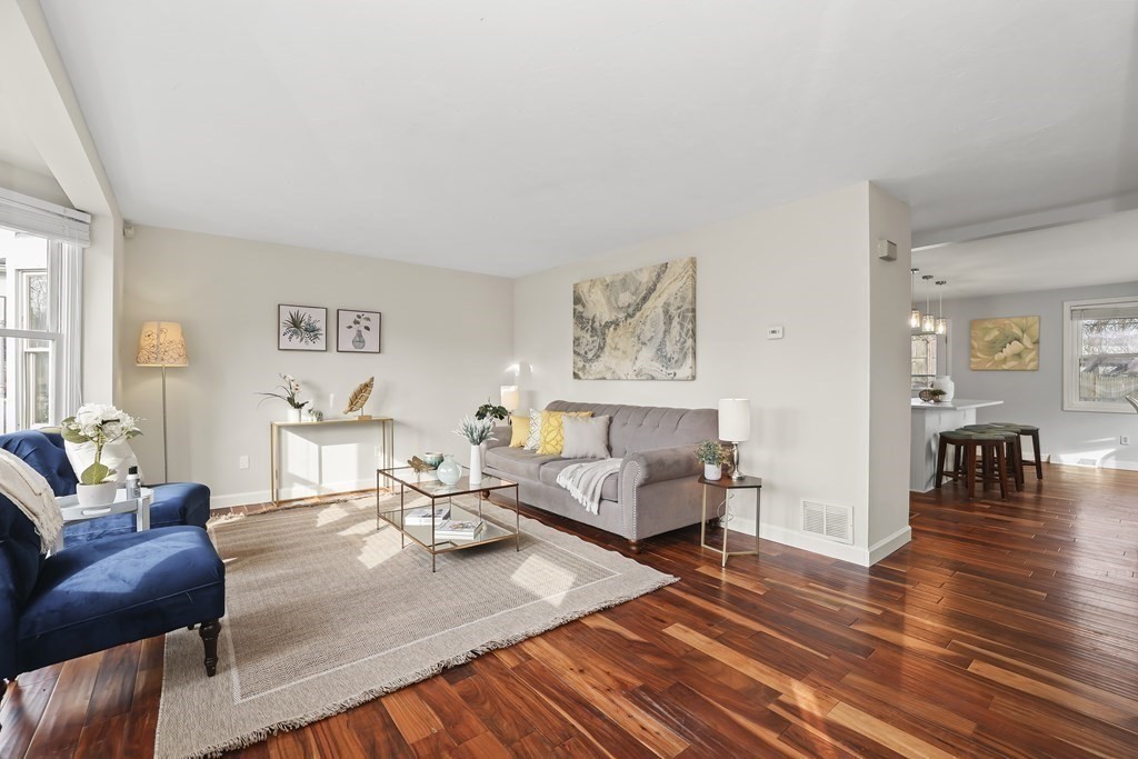 4 Rowe Court, Unit 4 Boston, MA 02131 - Photo 2 of 41 a living room with furniture and wooden floor