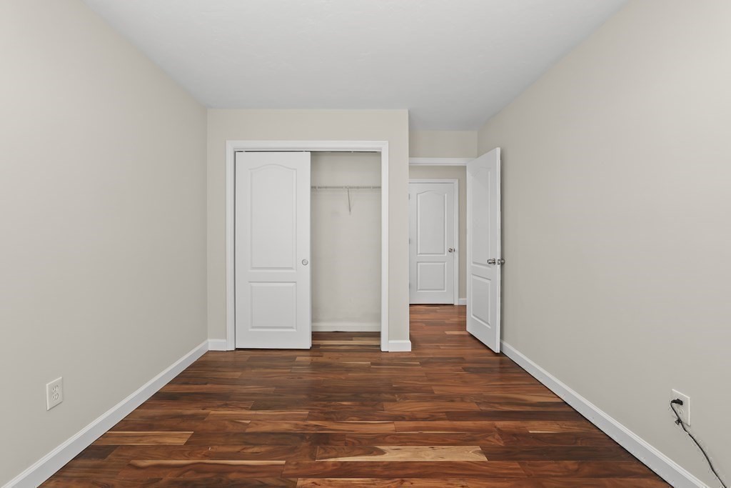 4 Rowe Court, Unit 4 Boston, MA 02131 - Photo 21 of 41 a view of a room with wooden floor