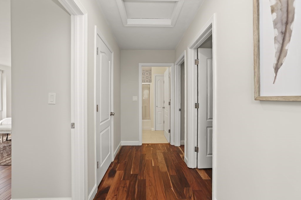 4 Rowe Court, Unit 4 Boston, MA 02131 - Photo 26 of 41 a view of a room with wooden floor and a bathroom