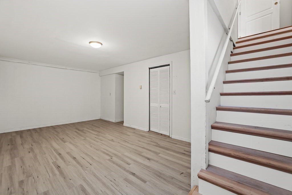 4 Rowe Court, Unit 4 Boston, MA 02131 - Photo 29 of 41 a view of entryway with wooden floor and stairs