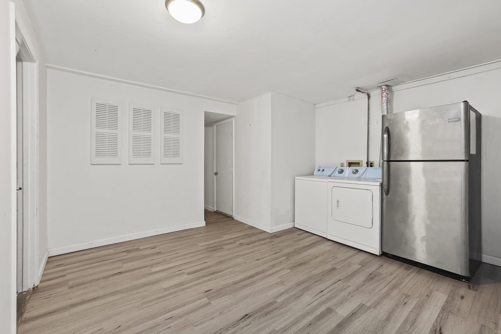 4 Rowe Court, Unit 4 Boston, MA 02131 - Photo 30 of 41 a view of a kitchen with wooden floor