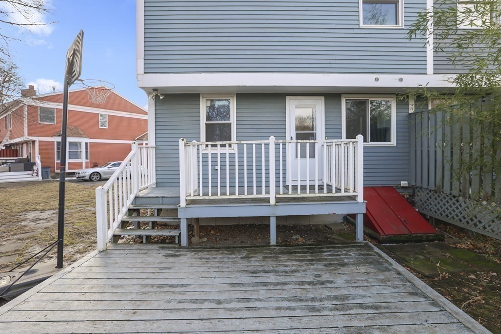 4 Rowe Court, Unit 4 Boston, MA 02131 - Photo 35 of 41 a view of house with wooden floor and outdoor seating