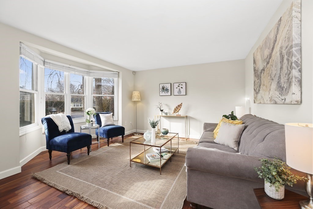 4 Rowe Court, Unit 4 Boston, MA 02131 - Photo 4 of 41 a living room with furniture and a large window