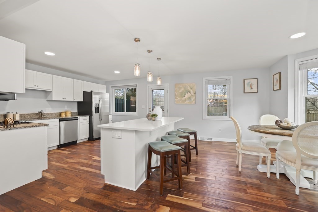 4 Rowe Court, Unit 4 Boston, MA 02131 - Photo 6 of 41 a living room with stainless steel appliances kitchen island granite countertop furniture and wooden floor