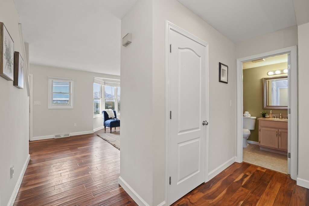 4 Rowe Court, Unit 4 Boston, MA 02131 - Photo 7 of 41 a view of a livingroom with wooden floor and a bathroom