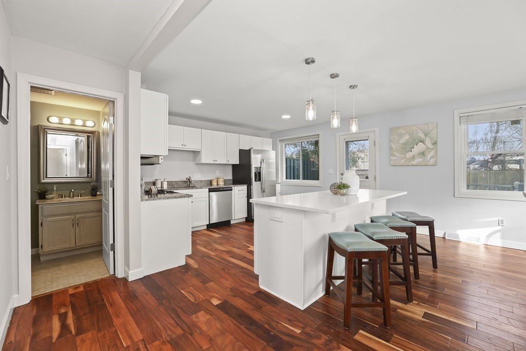 4 Rowe Court, Unit 4 Boston, MA 02131 - Photo 8 of 41 a kitchen with a table and chairs in it