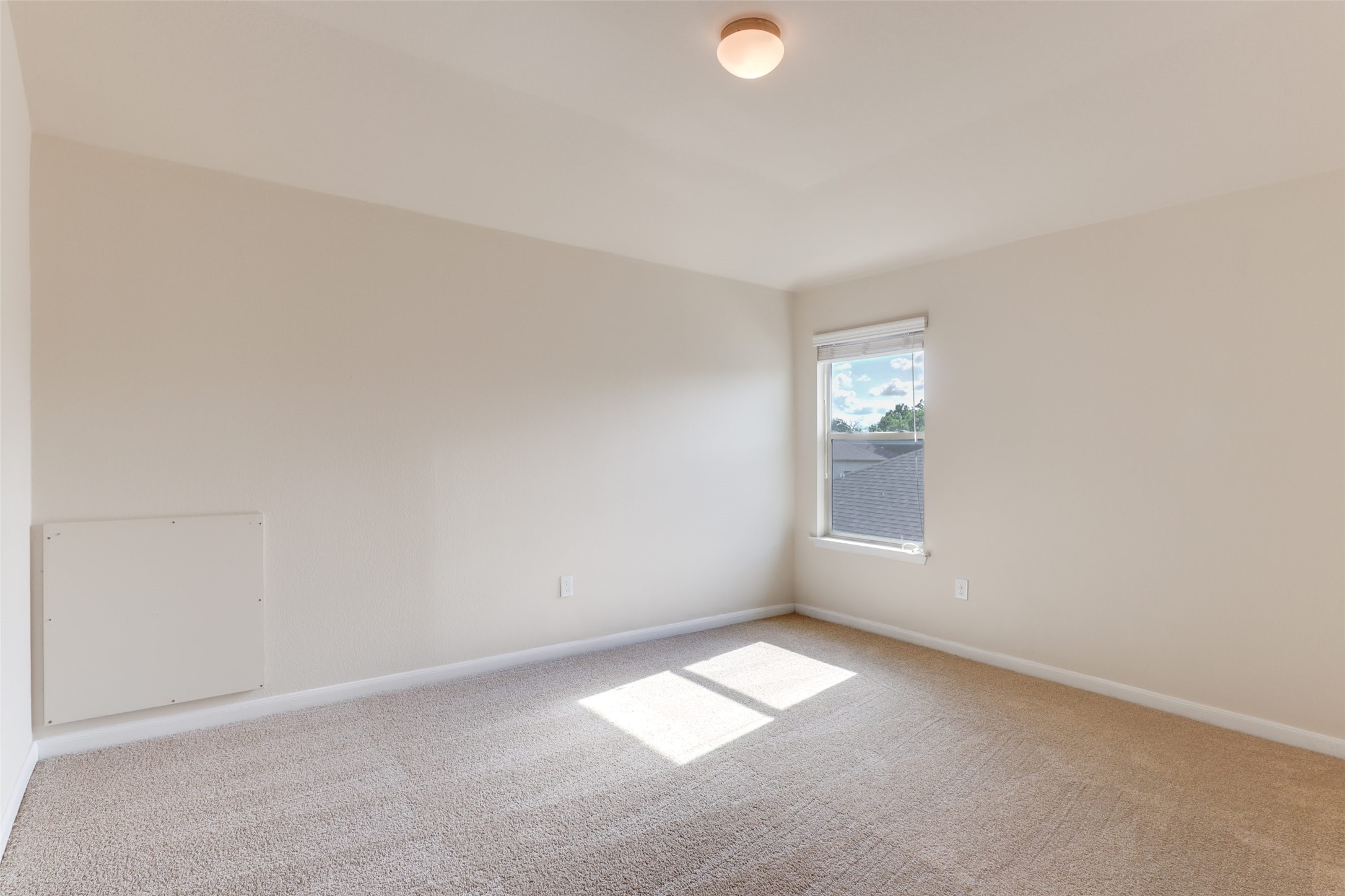 18705 Moreto Loop Pflugerville, TX 78660 - Photo 17 of 21 Naturally illuminated by a generous window, this comfortable bedroom offers a clean, inviting atmosphere.