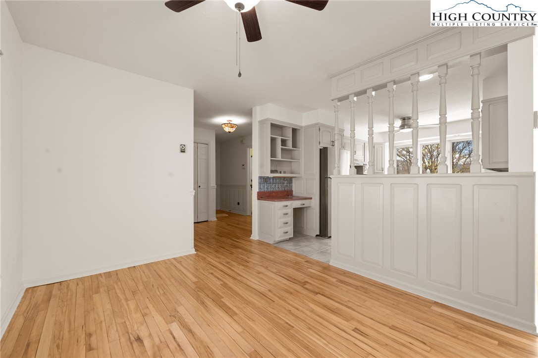 304 Glendale Drive Boone, NC 28607 - Photo 20 of 50 an empty room with wooden floor and windows