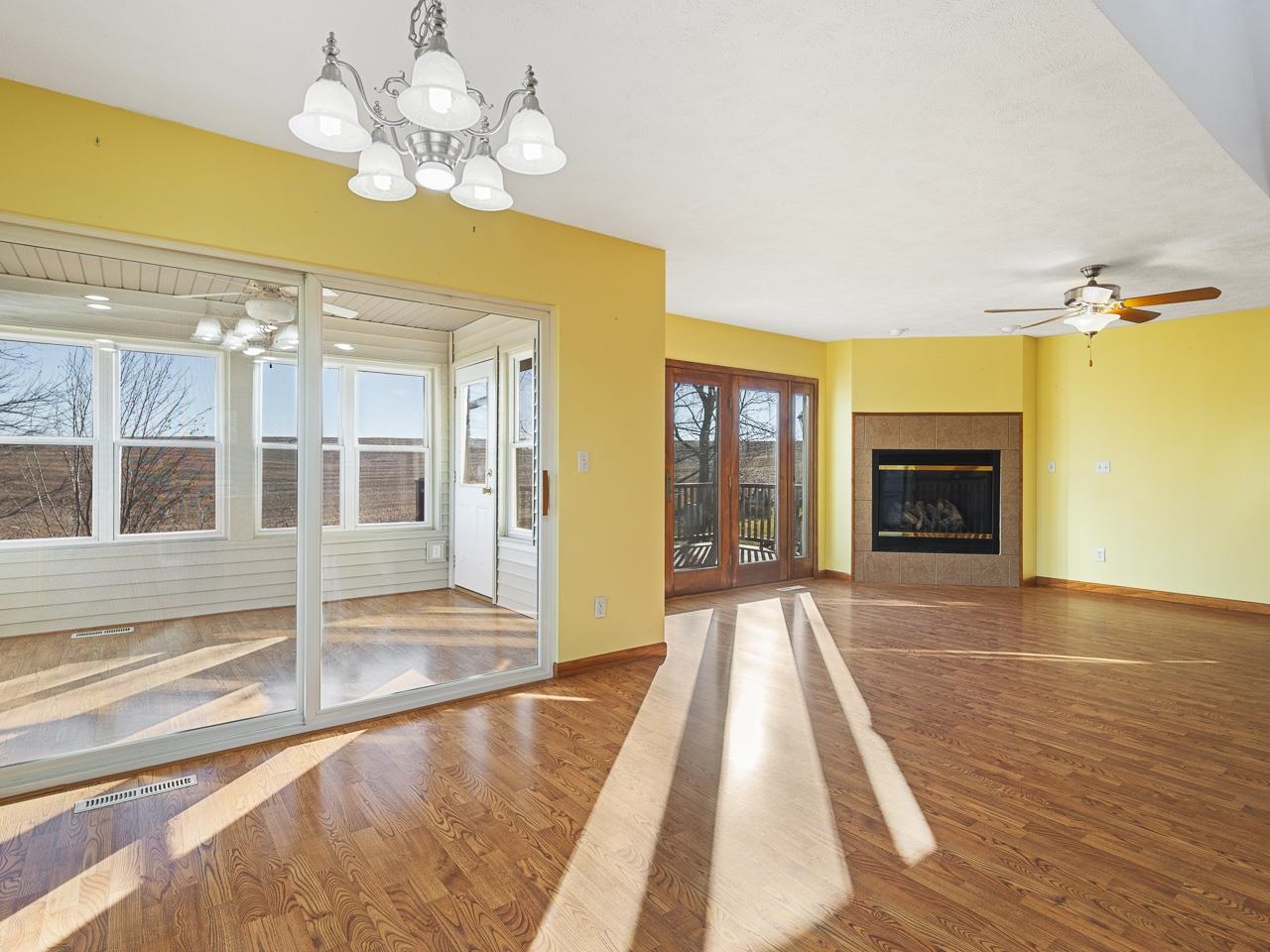 728 Westmore Road Davis, IL 61019 - Photo 11 of 45 a view of an empty room with a fireplace and chandelier