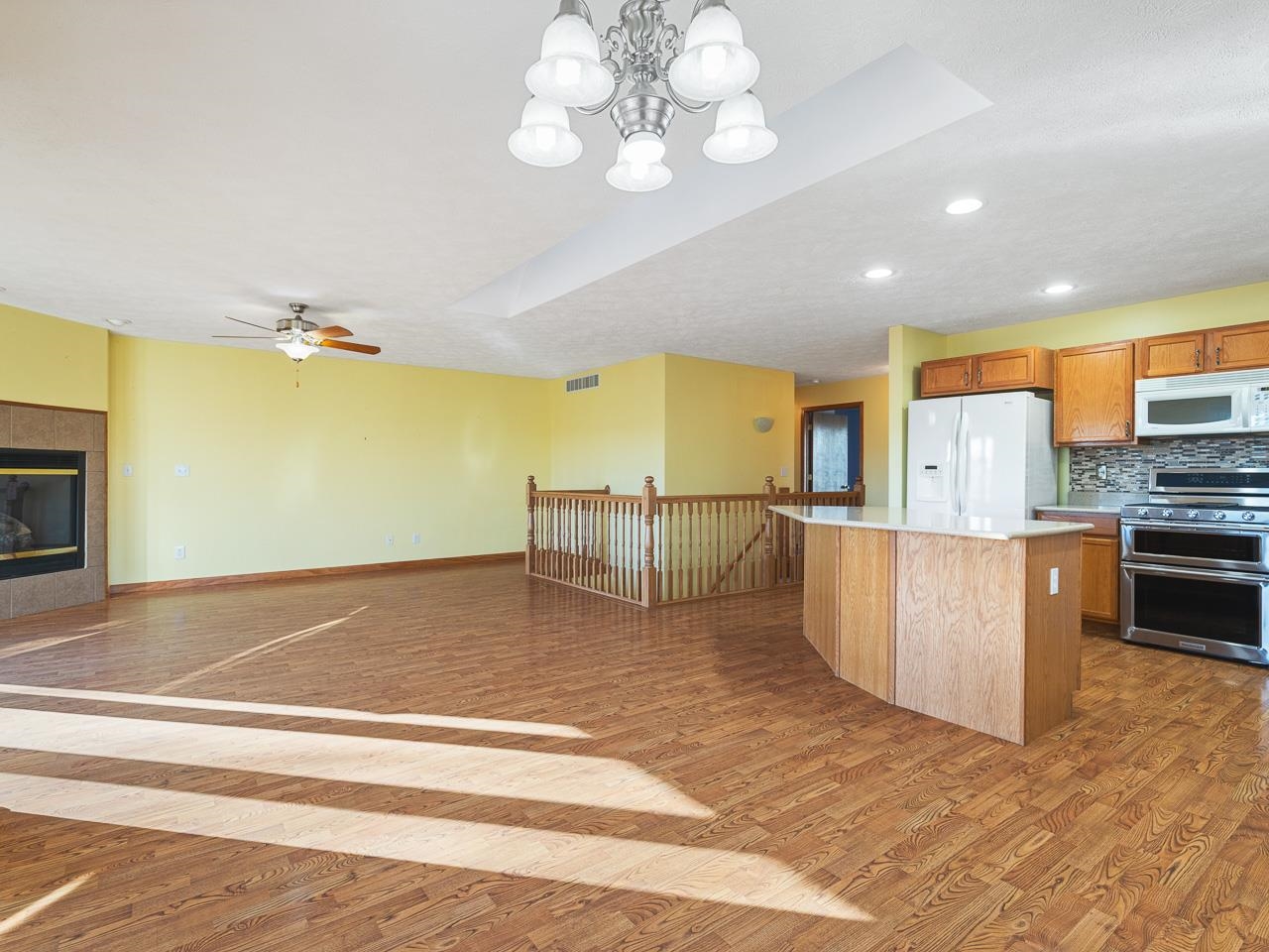 728 Westmore Road Davis, IL 61019 - Photo 12 of 45 a living room with stainless steel appliances kitchen island granite countertop a refrigerator a stove top oven a sink and dishwasher
