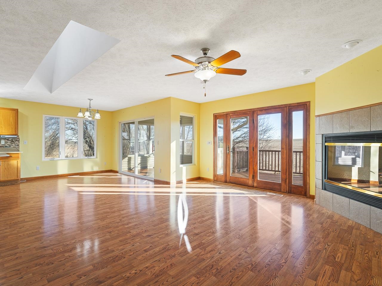 728 Westmore Road Davis, IL 61019 - Photo 13 of 45 a view of an empty room with wooden floor and a window
