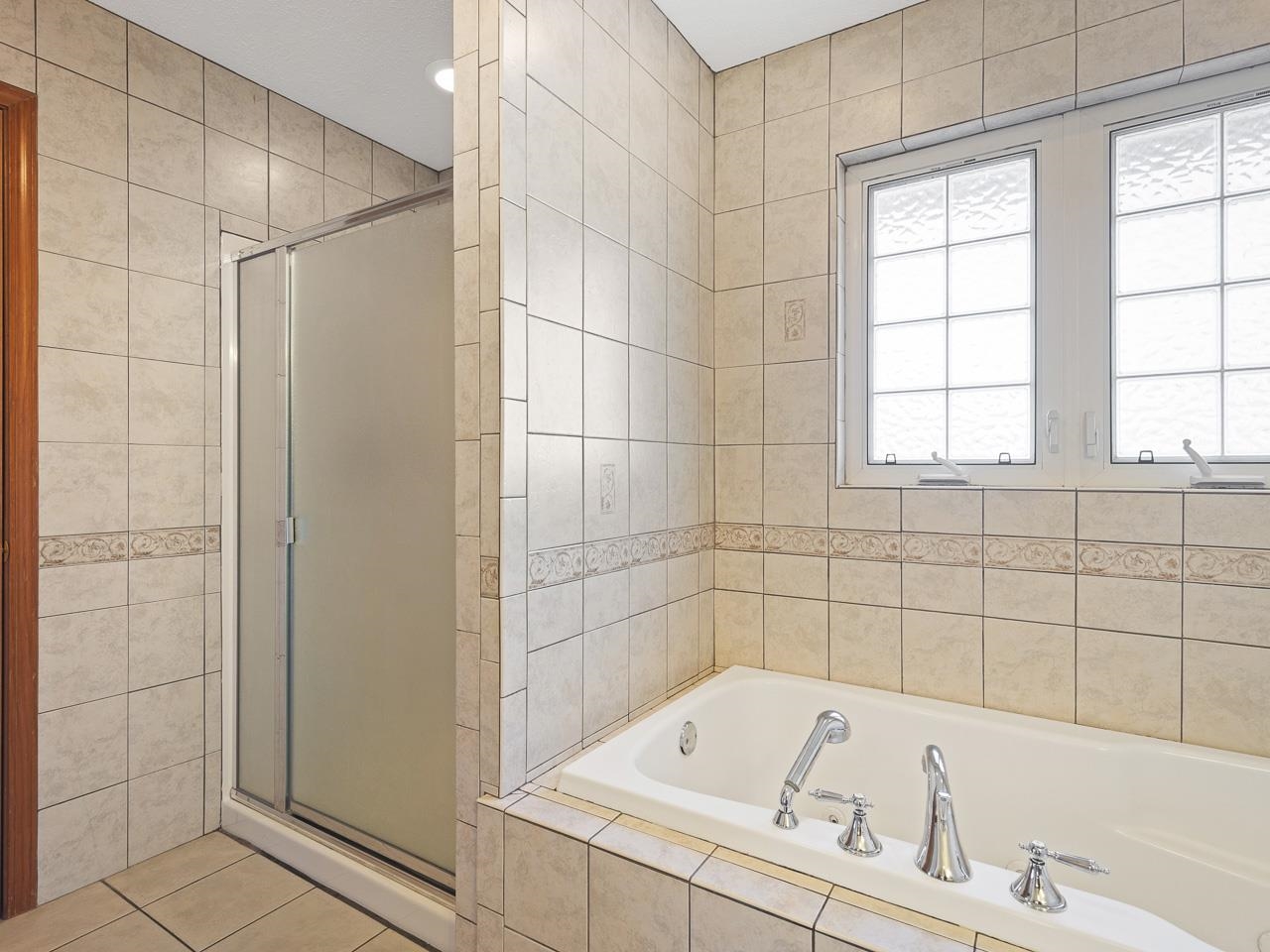 728 Westmore Road Davis, IL 61019 - Photo 18 of 45 a bathroom with a bathtub and a shower
