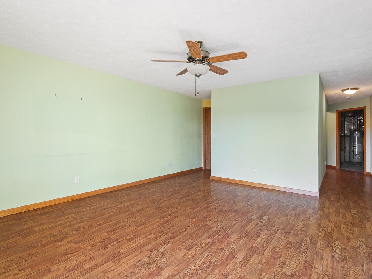 728 Westmore Road Davis, IL 61019 - Photo 24 of 45 a view of a room with wooden floor and a ceiling fan