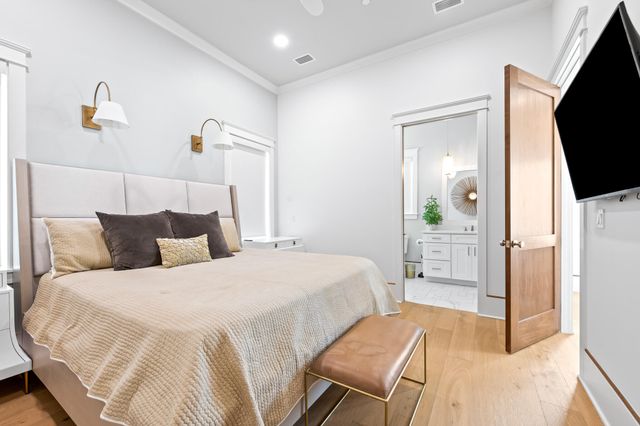 a view of a livingroom with furniture wooden floor and windows