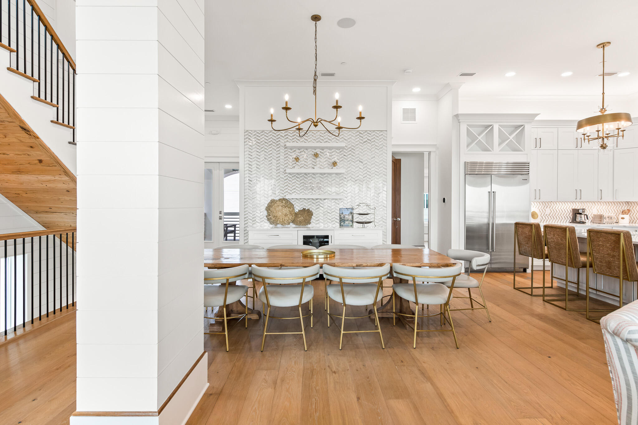 17 Palm Ct Lane Inlet Beach, FL 32461 - Photo 14 of 31 a dining room with wooden floor a chandelier a wooden table and chairs