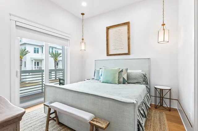 a bedroom with a large bed and a large window