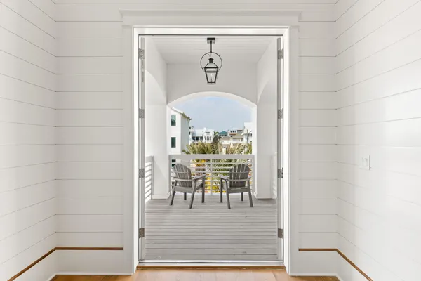 a view of a balcony with chairs