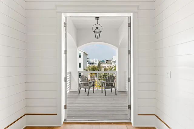 a view of a balcony with chairs