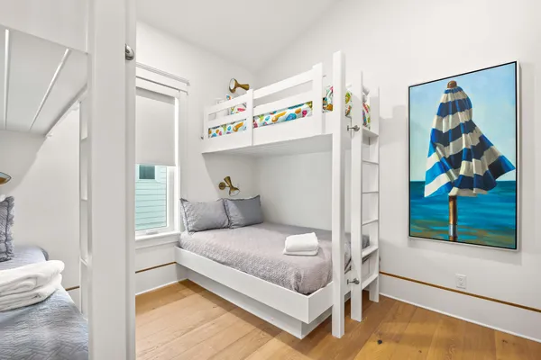a living room with a bed and a television