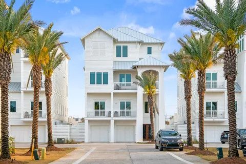 a view of staircase with wooden floor and white walls