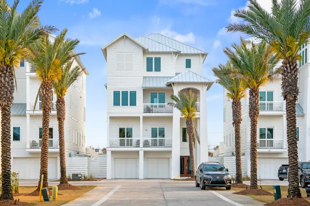 a view of staircase with wooden floor and white walls