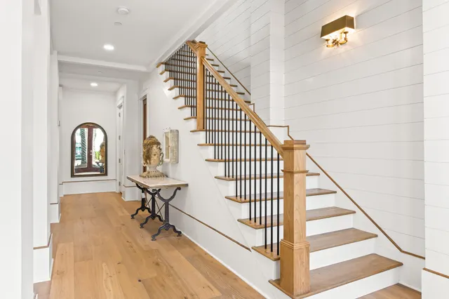 a view of a living room and entryway with wooden floor
