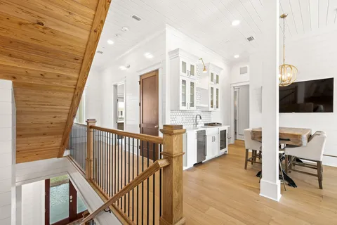 a view of a livingroom with wooden floor and a window
