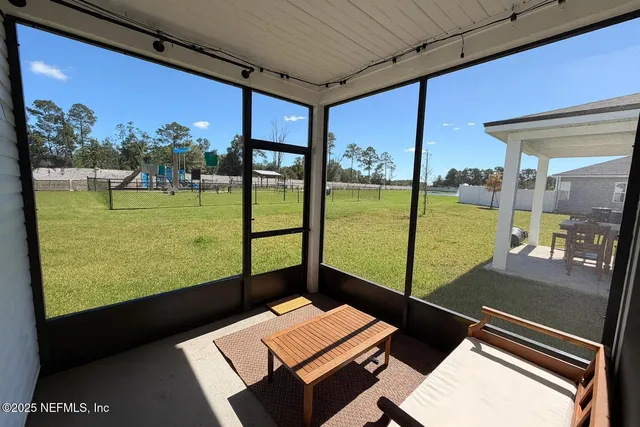 a view of a patio with a table and chairs