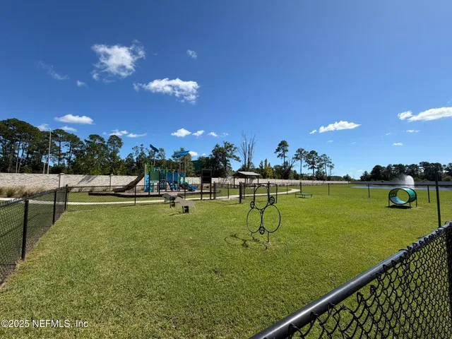 a view of a golf course with a swimming pool