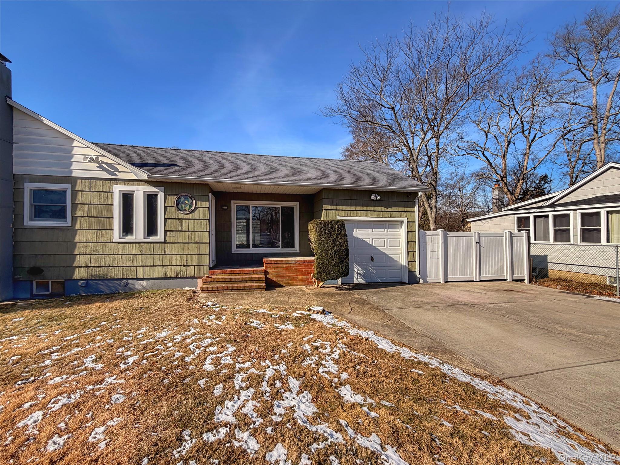 20 Bogota Road Mastic Beach, NY 11951 - Photo 1 of 34 a view of a house with a patio