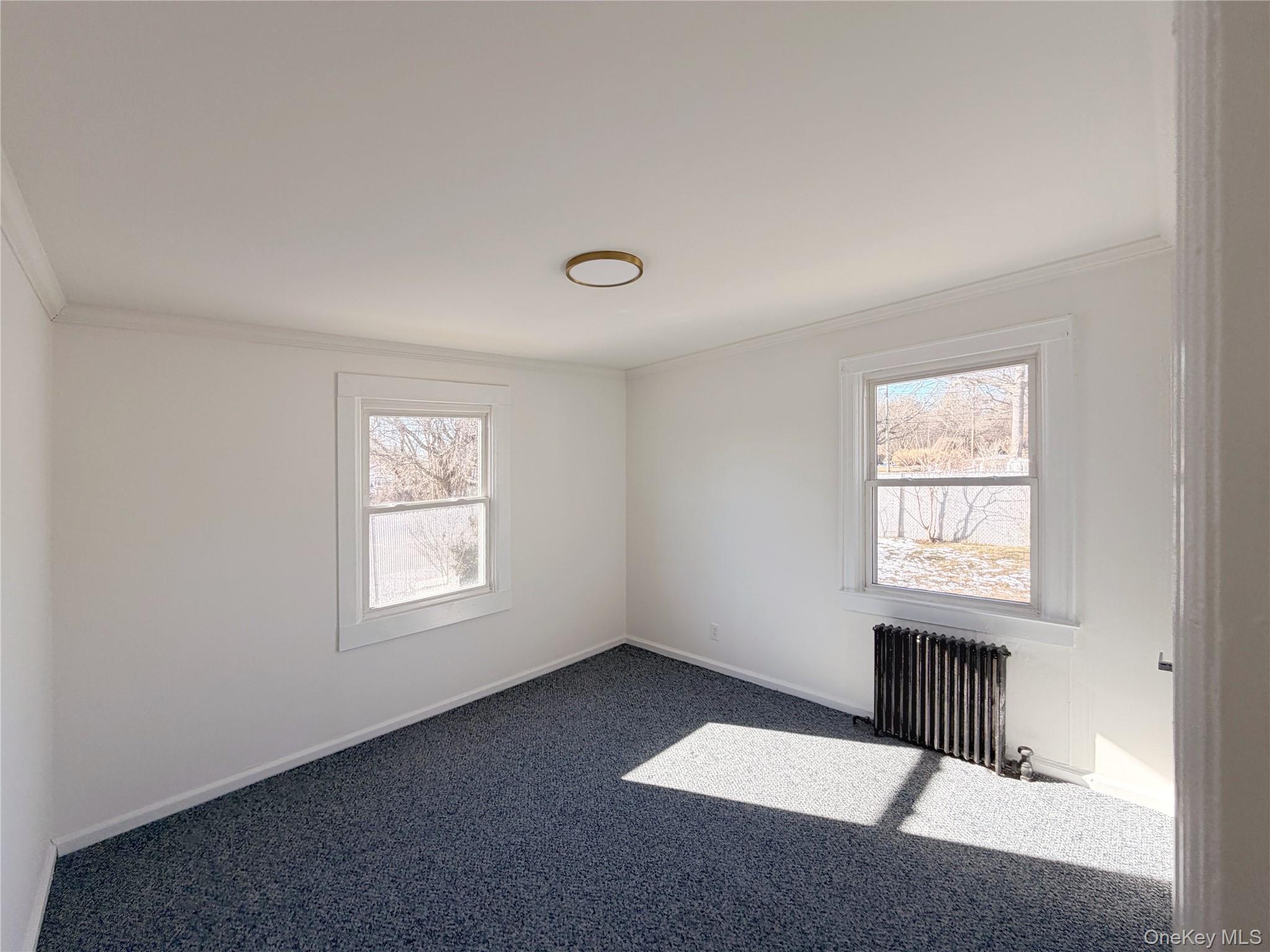20 Bogota Road Mastic Beach, NY 11951 - Photo 11 of 34 an empty room with windows