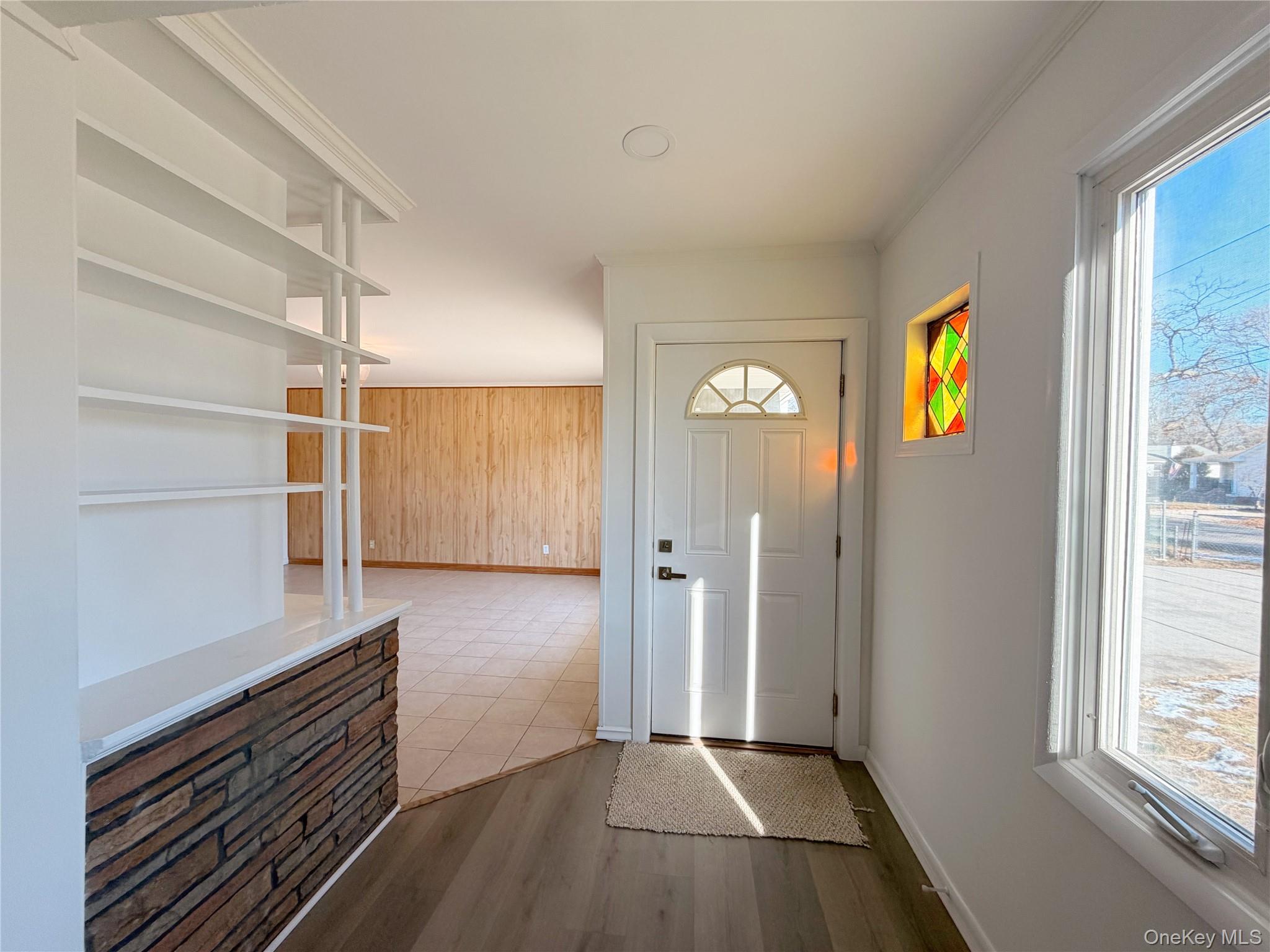 20 Bogota Road Mastic Beach, NY 11951 - Photo 16 of 34 a view of hallway with stairs and wooden floor