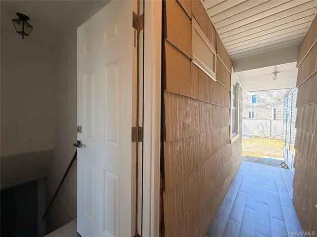 a view of a bathroom from a hallway