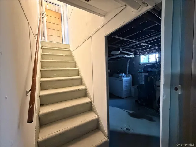 a room with a bed and a chandelier