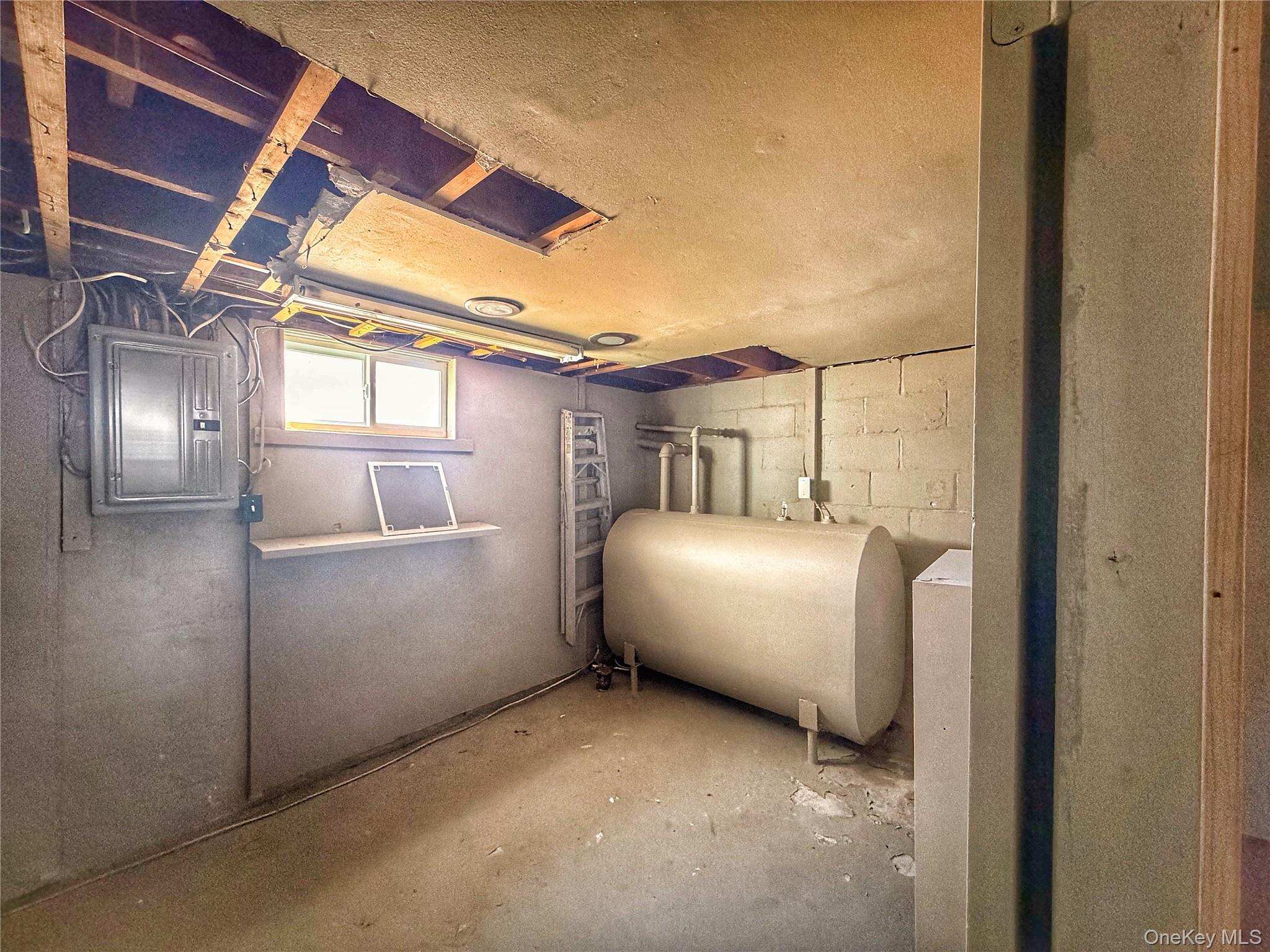 20 Bogota Road Mastic Beach, NY 11951 - Photo 22 of 34 a room with a bed and a chandelier