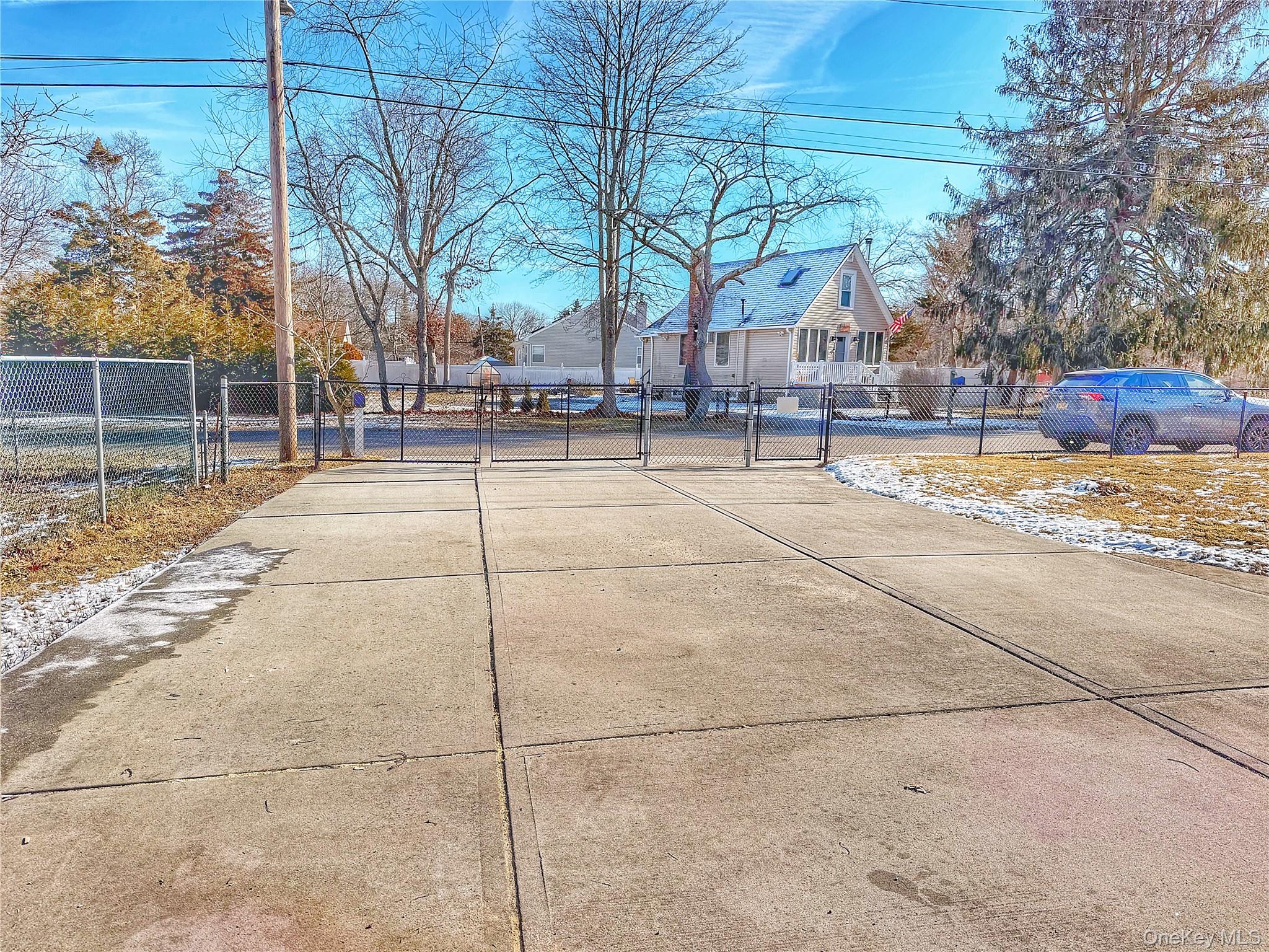 20 Bogota Road Mastic Beach, NY 11951 - Photo 32 of 34 a view of white house with a outdoor space