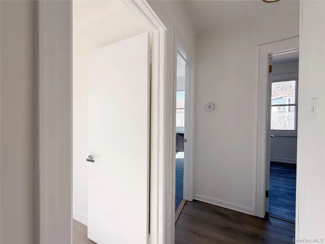 a view of front door with wooden floor