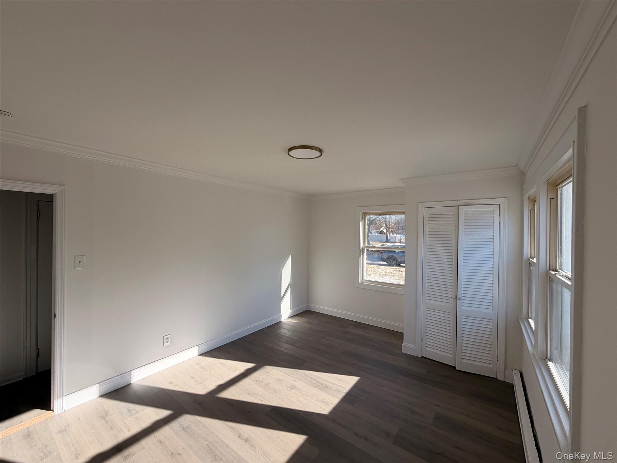 20 Bogota Road Mastic Beach, NY 11951 - Photo 9 of 34 a view of an empty room and window