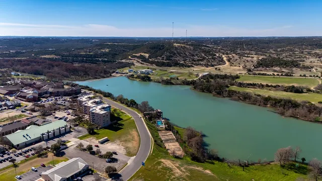 an aerial view of a house with a lake view