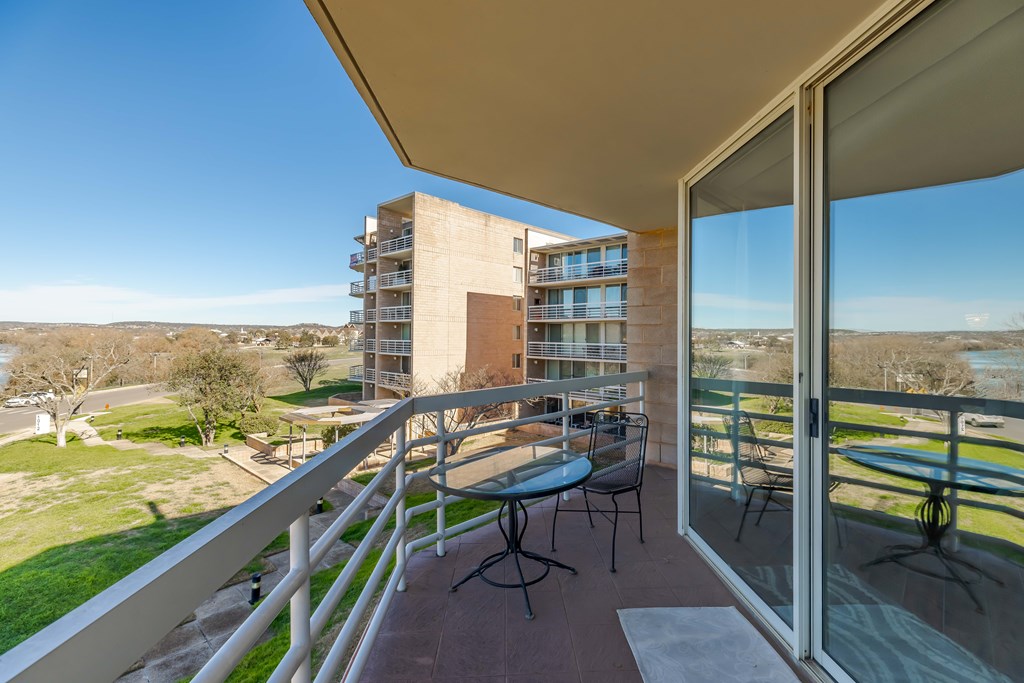 1006-3d Guadalupe Street Kerrville, TX 78028 - Photo 5 of 24 a city view from a balcony with furniture